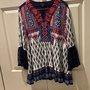 Calessa too. Multi color lace bell sleeves at the bottom edge.